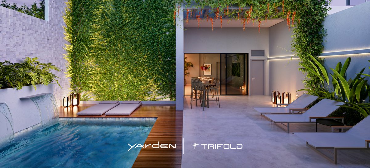 Espaço gourmet com piscina privativa do Yarden, iluminado à noite, com jardim vertical e espreguiçadeiras