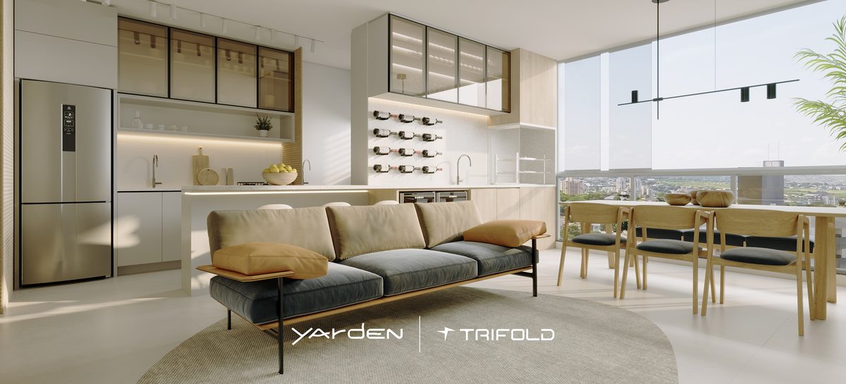 Living do apartamento decorado do Yarden, com sofá, cozinha integrada e mesa de jantar
